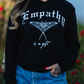 EMPATHY IS A GIFT WOMEN'S HOODIE